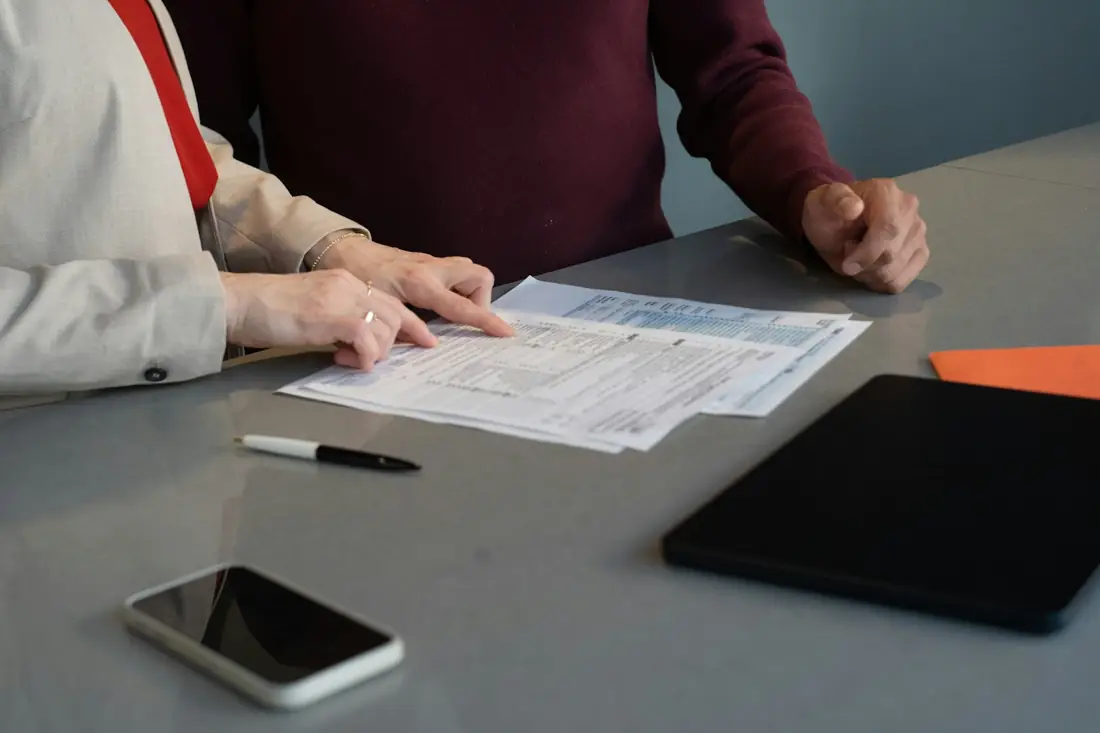 People reviewing documents at a table